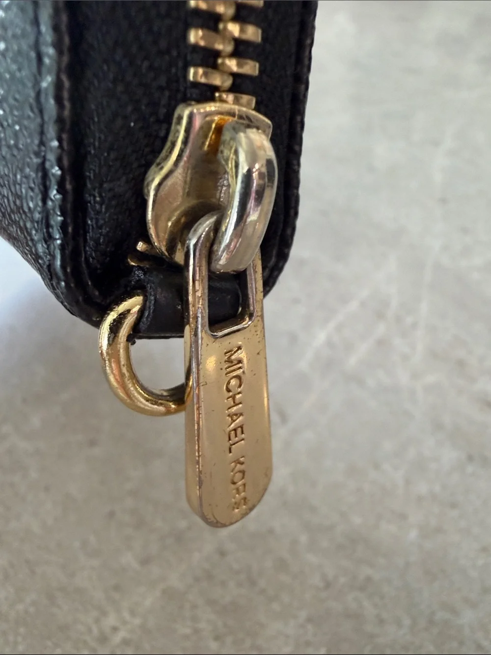 Michael Kors Black Zip-Around Wallet with Gold Logo Plate